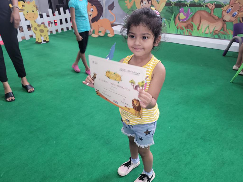 Trehan IRIS Broadway Summer Camp – Kid showing the Certificate of Participation